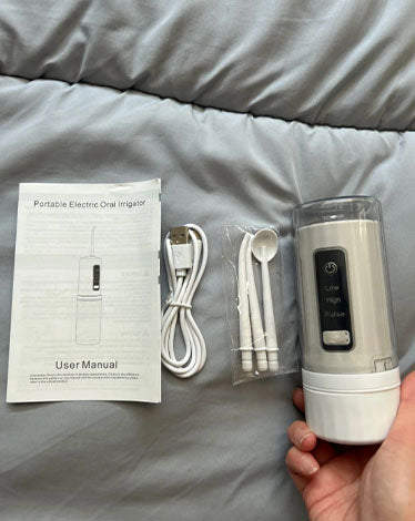 jet dentaire de voyage rechargeable - avis clients - oralirrigator.fr